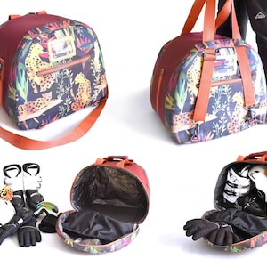 May include: A round, red and black duffel bag with a cheetah print design. The bag has a zipped pocket on the front and a long strap. The bag is open and filled with ski boots, gloves, and a helmet.