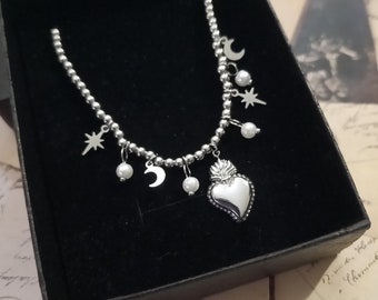 Bracciale in acciaio con sacro cuore perle luna stelle