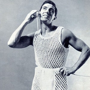 May include: A white crocheted tank top with a mesh design. The tank top is sleeveless and has a scoop neck.