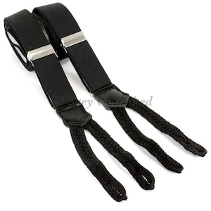 Peut inclure: Bretelles noires avec des accents en cuir et des bretelles réglables. Les bretelles ont une conception à boutons et sont faites d'un matériau durable.