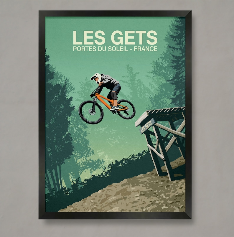 May include: A retro-style poster featuring a mountain biker in mid-air, performing a trick over a wooden ramp. The poster has a green background with trees and the text "LES GETS PORTES DU SOLEIL - FRANCE".