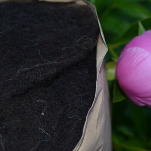 carded wool as fleece in natural dark brown (black-brown) from the Black Mountain Sheep