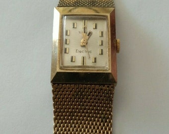 1960s TIMEX electric watch gold Plated base stainless steal metal bezel England