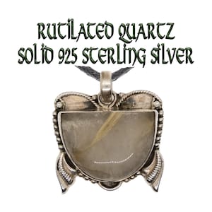 Rutilated Quartz Handmade 925 sterling silver pendant. Beautiful piece with art deco style detailing silver around the quartz