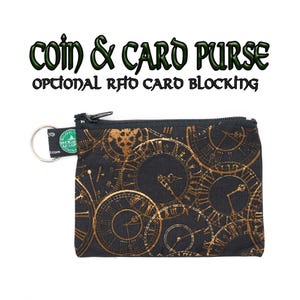 May include: A black zippered coin and card purse with a gold clock pattern. The purse has a key ring attached to it. The text "coin & card purse" and "optional RFID card blocking" is printed on the image.