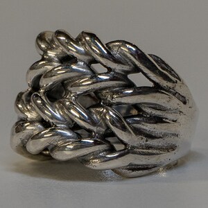 Keeper ring handmade from 925 sterling silver.  Hand woven & braided silver strands make up this incredible design.  Very chunky and heavy ring weighing approximately 34 - 38 grams