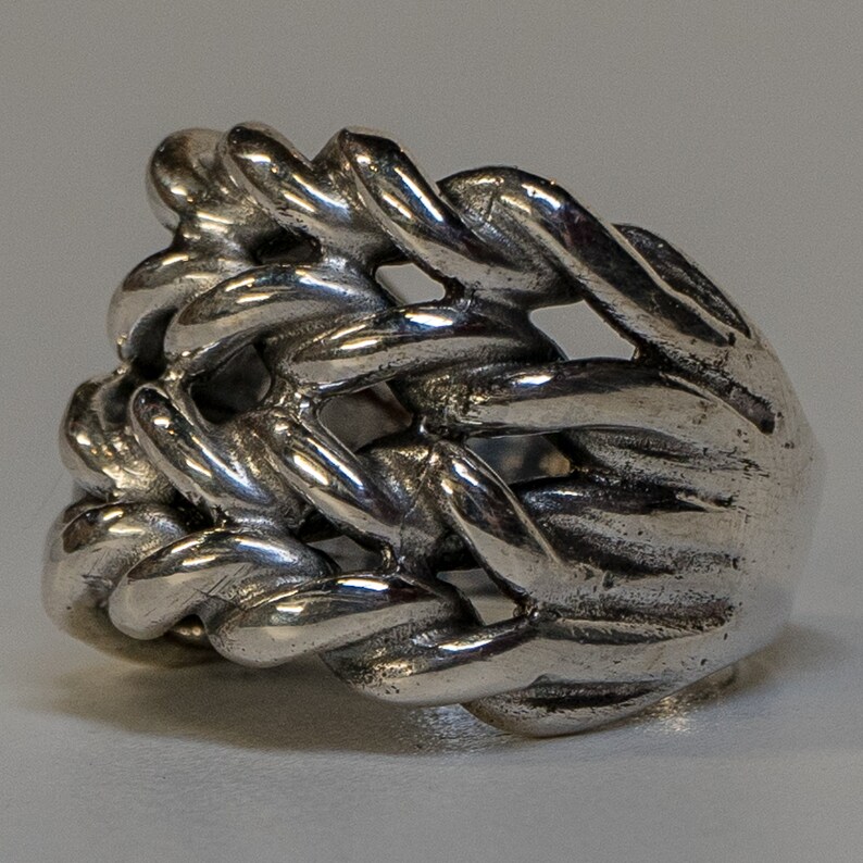 Keeper ring handmade from 925 sterling silver.  Hand woven & braided silver strands make up this incredible design.  Very chunky and heavy ring weighing approximately 34 - 38 grams
