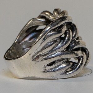 Keeper ring handmade from 925 sterling silver.  Hand woven & braided silver strands make up this incredible design.  Very chunky and heavy ring weighing approximately 34 - 38 grams