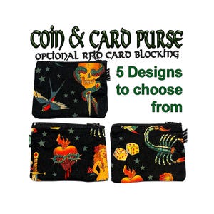May include: Three black coin purses with different colourful tattoo-inspired designs. The designs include a skull with a snake, a heart with a dagger, and a scorpion with dice. The text on the image reads "coin & card purse optional RFID card blocking 5 Designs to choose from".