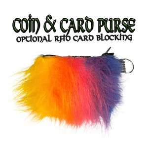 May include: A rainbow-coloured fuzzy coin and card purse with a zipper closure and a silver ring. The text "coin & card purse" and "optional RFID card blocking" is printed on the top of the image.