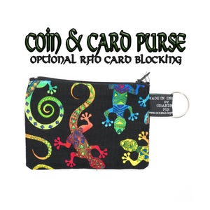May include: Black coin and card purse with a colorful lizard pattern. The purse has a zipper closure and a key ring. Text on the purse reads "COIN & CARD PURSE" and "OPTIONAL RFID CARD BLOCKING."