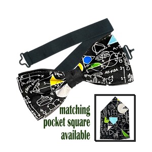May include: Black bow tie with a white and colorful mathematical equations pattern. Matching pocket square available.