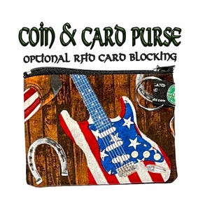 May include: A small coin and card purse with a zipper closure. The purse is made of fabric with a woodgrain background and a red, white, and blue guitar with stars and stripes. The text "coin & card purse" and "optional RFID card blocking" is printed on the image.