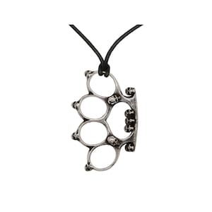 May include: Silver-coloured knuckle duster pendant necklace. The pendant features a four-finger design with skull accents. The necklace has a black cord.