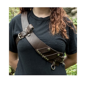 Great Bandolier handmade from Leather.  Fully adjustable, rings to attach utility accessories/pouches/holsters, ideal for pirates & cosplay