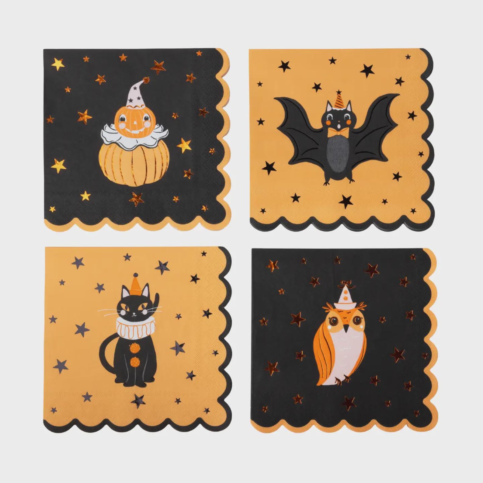 A Scalloped Paper Napkin as the Color Accent Scalloped Halloween paper napkins with illustrated cats, pumpkins, bats and a fox.