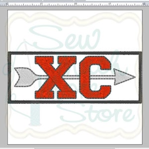 May include: Red and white embroidered patch with the letters "XC" and a white arrow pointing to the right. The patch is surrounded by a black border.