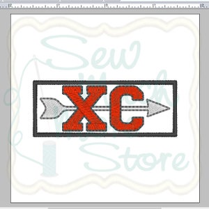 May include: Red and white embroidered patch with the letters "XC" and an arrow pointing to the right. The patch is surrounded by a gray border.