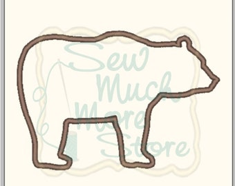 May include: Outline of a brown bear, suitable for embroidery or applique projects.
