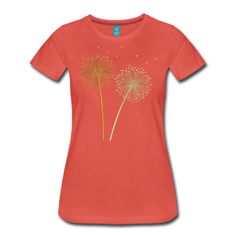 May include: A coral colored t-shirt with a gold embroidered design of two dandelions with seeds blowing in the wind.