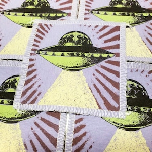 alien patch handmade screen printed patch on upcycled t shirts sew to clothing  alien spaceship theme purple and green colors by blobdogCo