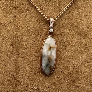 Long Oval Shaped Gold Quartz and Diamond Pendant Set in 14k Rose Gold.