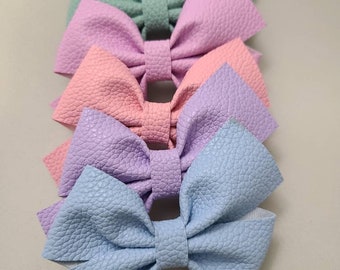 Faux leather pinwheel style bows - (7cm / 2.75 in)