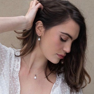 Freshwater pearl bridal jewellery set. sterling silver pendant set on fine chain with a smooth freshwater pearl drop & hook earrings | iris