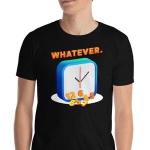 May include: Black t-shirt featuring a cartoon clock design with the word "WHATEVER" in orange letters above the clock. The clock is blue with a white face and orange numbers. The hands of the clock point to 5:00.