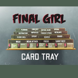 May include: A wooden card tray for the Final Girl board game. The tray has multiple levels with labels including "Planning", "Sprint", and "Focus". The words "Final Girl" are in red and black lettering above the tray, and "Card Tray" is below.