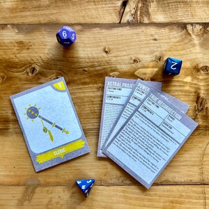 May include: Four cards with text and illustrations for a tabletop role-playing game. The cards are grey with yellow accents and feature the titles "Astral Projection", "Power Word: Kill", "True Resurrection", and "Cleric".