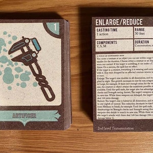 May include: A brown card with a blue and white illustration of a wrench. The card is titled "Artificer" and has the number "1" in the top right corner. The card also has text that reads "Enlarge/Reduce", "Casting Time: 1 action", "Components: V, S, M", "Range: 30 feet", "Duration: Concentration, up to 1 minute", and "A pinch of powdered iron".