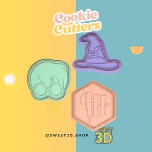 May include: Set of three Harry Potter themed cookie cutters. The cutters are shaped like Harry Potter's glasses, the Sorting Hat, and the Hogwarts crest. The cutters are made of a light pink, light green, and purple plastic.