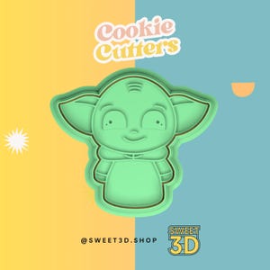 May include: Green cookie cutter shaped like a character from Star Wars, with the text "Cookie Cutters" above and "SWEET 3D" below. The character has large ears, big eyes, and a small mouth.