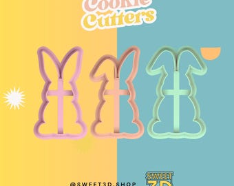 May include: Three cookie cutters shaped like bunnies. The cutters are pink, peach, and light green. The text "Cookie Cutters" is at the top of the image. The text "@SWEET3D.SHOP" and "SWEET 3D" are at the bottom of the image.
