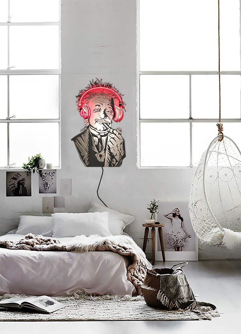 May include: A neon sign depicting a man with a mustache wearing headphones and smoking a pipe. The sign is mounted on a white wall in a bedroom setting.