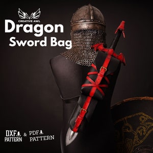 May include: A black leather sword bag with red straps and a dragon design. The bag is attached to a chainmail shirt and a sword. The text "Dragon Sword Bag" is visible at the top of the image.