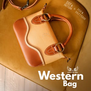 May include: A two-tone leather Western bag with a handle and strap. The bag is light tan with brown accents and stitching. The bag has a curved design and metal hardware. The words "Western Bag" are at the bottom of the image.