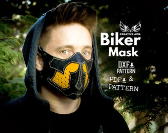 May include: A black leather biker mask with yellow accents and a stitched design. The mask is worn by a person with a hooded sweatshirt. The text "Biker Mask" is displayed above the mask, with the text "DXF PATTERN" and "PDF PATTERN" below the mask.