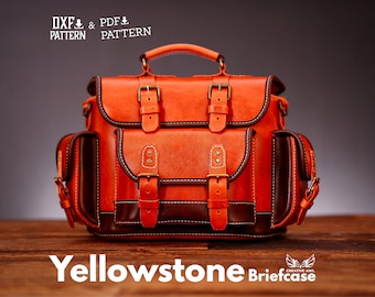 May include: A brown leather briefcase with a top handle and multiple buckles. The bag is labelled "Yellowstone Briefcase" and has a logo for "Creative Awl".