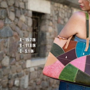 May include: A multicoloured patchwork tote bag featuring leather panels in shades of green, pink, brown, and tan with visible stitching. The bag dimensions are labelled as A- 40 cm, B- 30 cm, and C- 13 cm, with two sturdy shoulder straps.