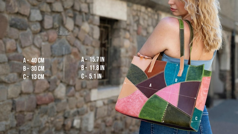 May include: A multicoloured patchwork tote bag featuring leather panels in shades of green, pink, brown, and tan with visible stitching. The bag dimensions are labelled as A- 40 cm, B- 30 cm, and C- 13 cm, with two sturdy shoulder straps.