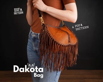 May include: A brown leather Dakota bag with fringe detailing. The bag is worn by a person wearing a brown top and blue jeans. The text "Dakota Bag" is visible at the bottom of the image. The text "DXF & PATTERN" is visible in the top left corner of the image. The text "& PDF & PATTERN" is visible in the top right corner of the image.