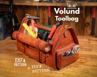 May include: A brown leather tool bag with a variety of tools inside, including a hammer, a screwdriver, a tape measure, and a wrench. The bag has a zippered pocket on the front and a flap that closes with a buckle. The bag is sitting on a wooden surface. The text "Volund Toolbag" is printed on the bag.