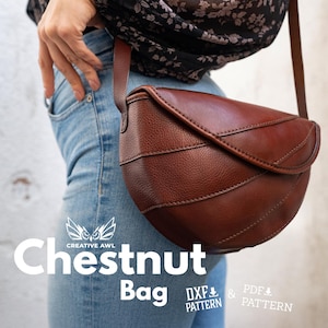 May include: A brown leather Chestnut Bag with a curved design and a long strap. The bag is worn over the shoulder. The bag has a textured surface and is made of leather. The text "Chestnut Bag" is displayed in white.