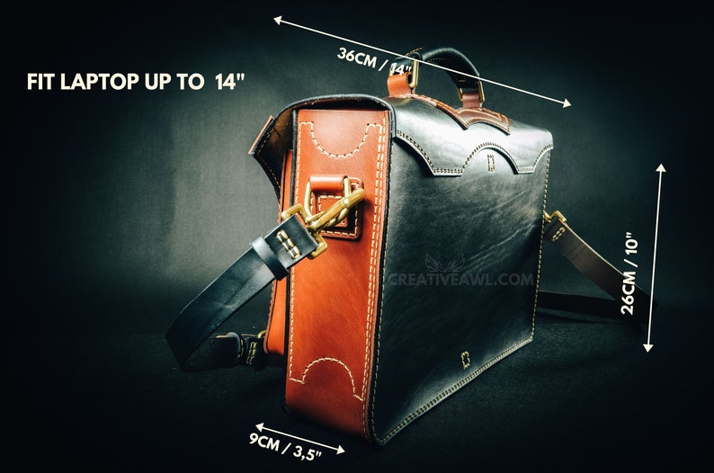 May include: A handcrafted leather messenger bag in black and brown, with white stitching and brass hardware. The bag is 14 inches wide, 10 inches tall, and 3.5 inches deep. It fits a laptop up to 14 inches. The bag has a handle and a shoulder strap.