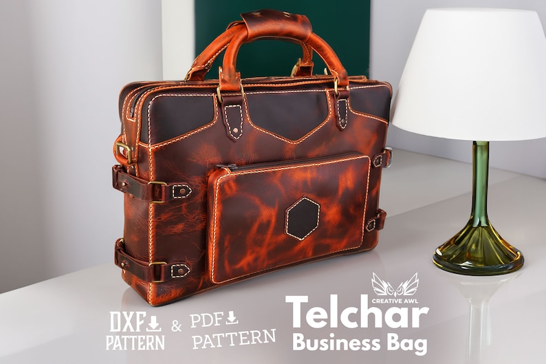 May include: A brown leather business bag with a front pocket and a top handle. The bag has a distressed look and is stitched with yellow thread. The text "Telchar Business Bag" is printed below the bag.
