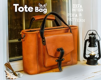 May include: A brown leather tote bag with a black leather handle and a black leather pocket on the front. The bag is sitting on a windowsill with a black lantern to the right. The text "Tote Bag" is written in white letters on a black background above the bag. The text "DXF & PATTERN" and "PDF & PATTERN" is written in white letters on a black background above the lantern.
