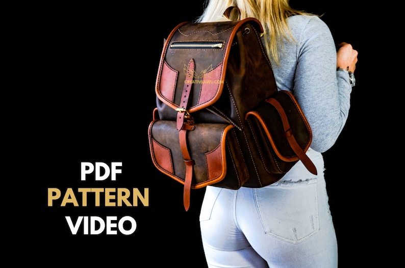 May include: A brown leather backpack with a flap closure and a buckle. The backpack has two side pockets and a zippered pocket on the front. The backpack is being worn by a person wearing white jeans and a grey shirt.