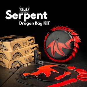 May include: A black and red dragon bag kit with the text "Serpent Dragon Bag KIT". The kit includes a black and red dragon-shaped bag, cardboard boxes, and other crafting supplies. The bag features a red dragon wing design.